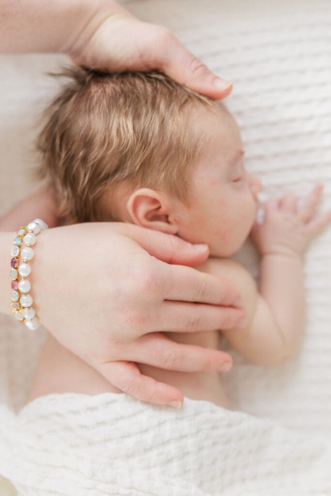 Tender mother and baby moment at in-home session in Boise.