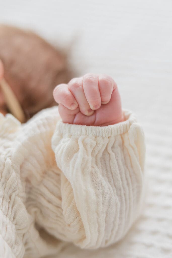 Newborn hand detail photographed in soft light by an ID photographer
