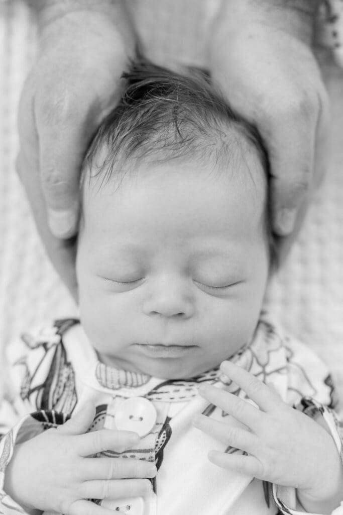 Soft black and white portrait of newborn sleeping peacefully